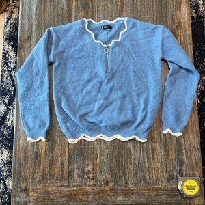 Stylish Blue V-Neck Sweater with White Trim